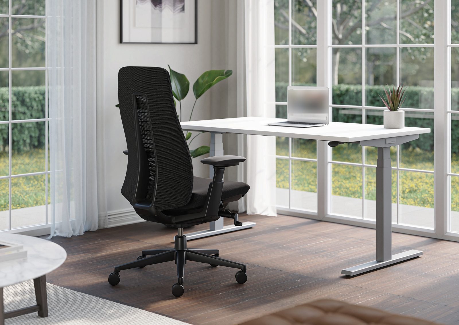 Home work corner by a daylight window with white desk and Haworth Fern chair